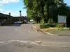 Entrance Two Looking Towards Admin Building and Boiler House. Boiler House Chimneys in View